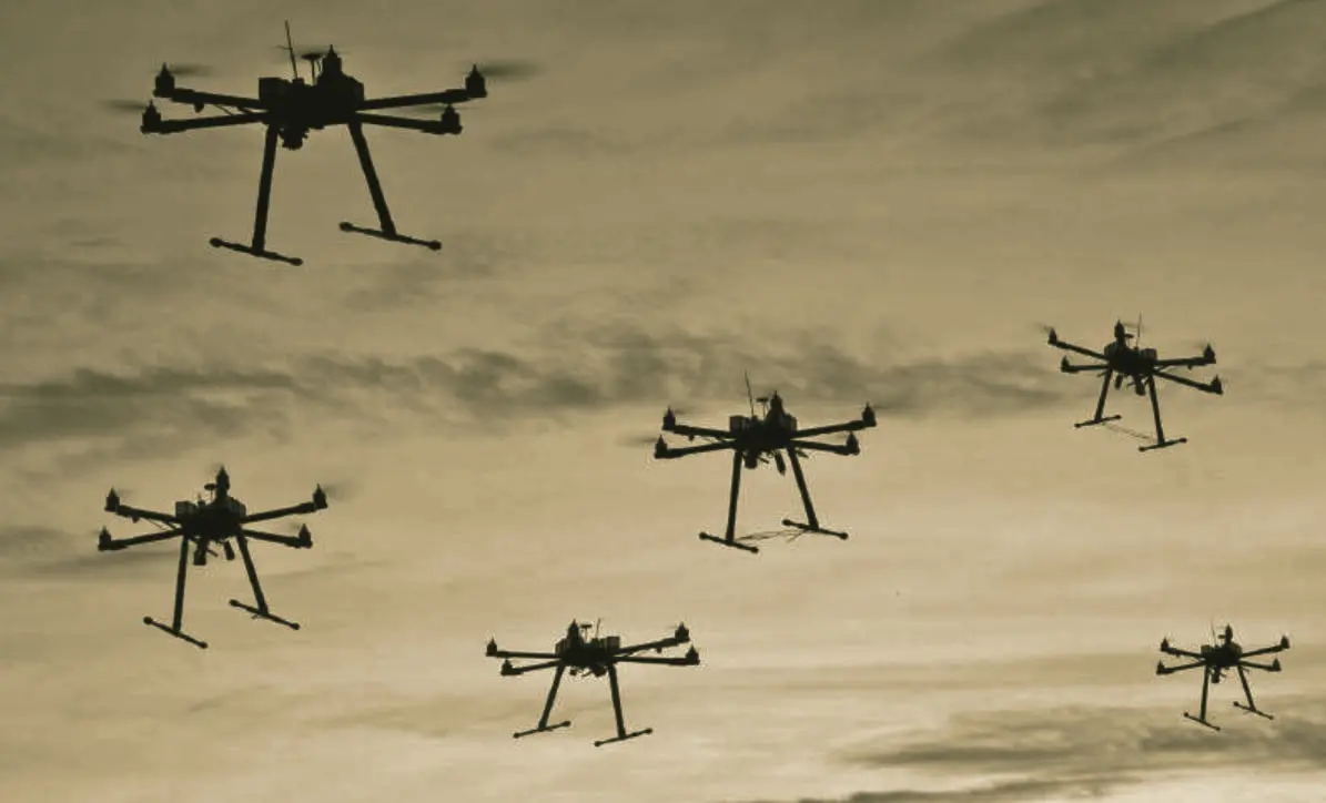 A formation of multi-rotor drones in flight